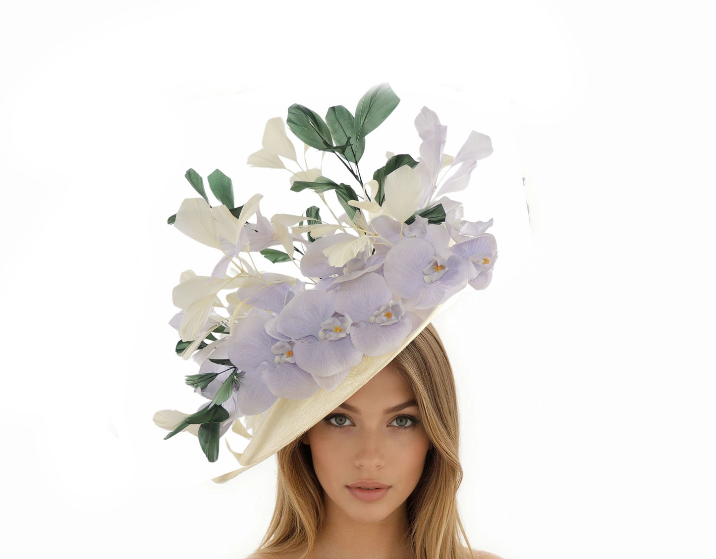 Woman wearing Beatrix Feather & Flower Statement Fascinator Hat with large delicate flowers and green leaves on cream base