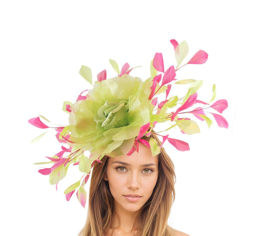 Woman wearing a vibrant Britney Large Feather Rose Floral Fascinator Hat with green and pink feathers and floral accents