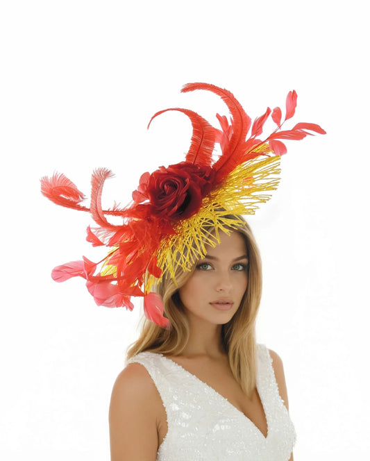 Woman wearing Cordelia – Statement Ascot Feather Fascinator Hat with red feathers and yellow netting detail