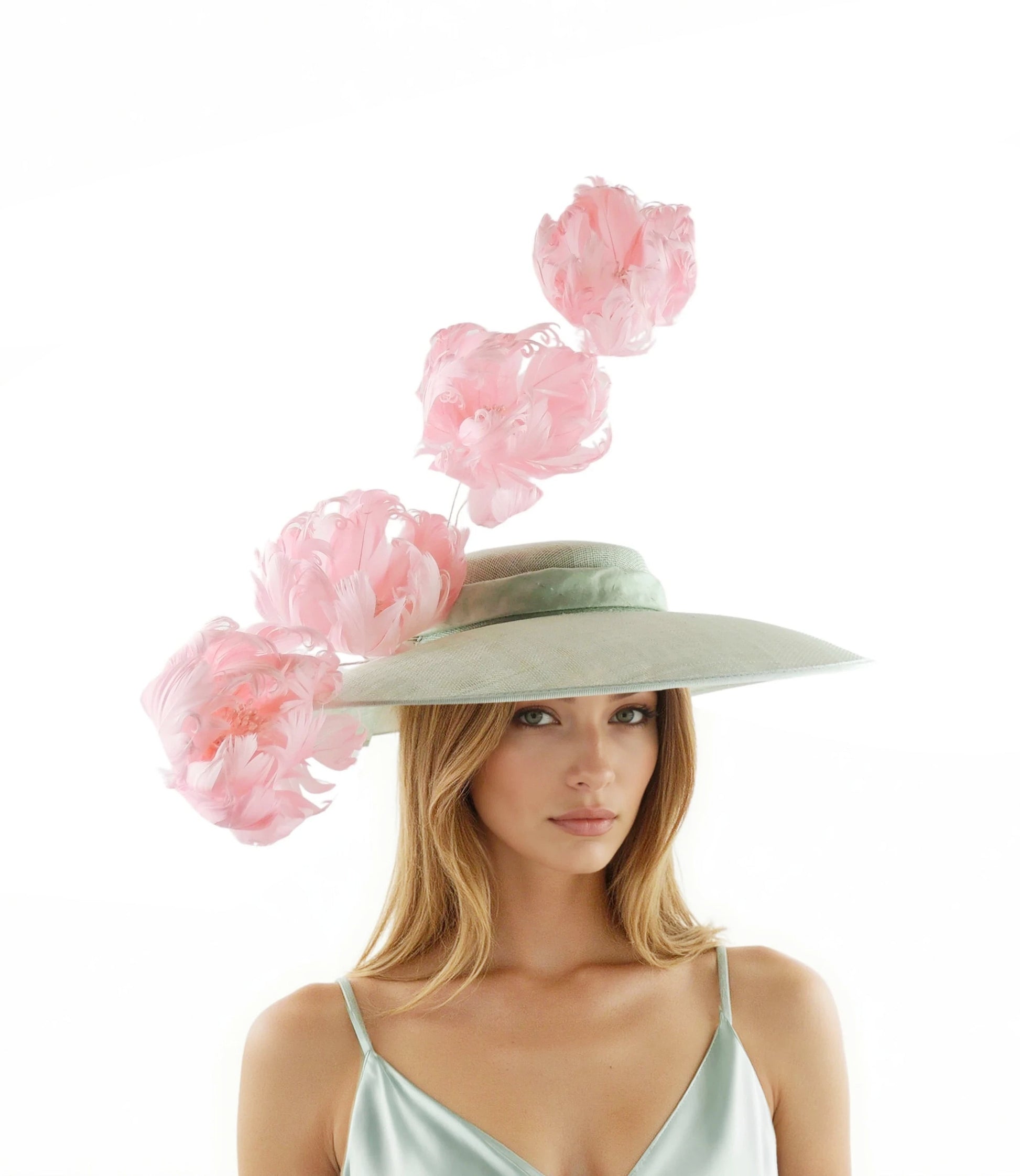 Elizabeth - Statement Boater Hat – Kentucky Derby, Royal Ascot, Race Day worn by woman with pink floral accents and elegant design