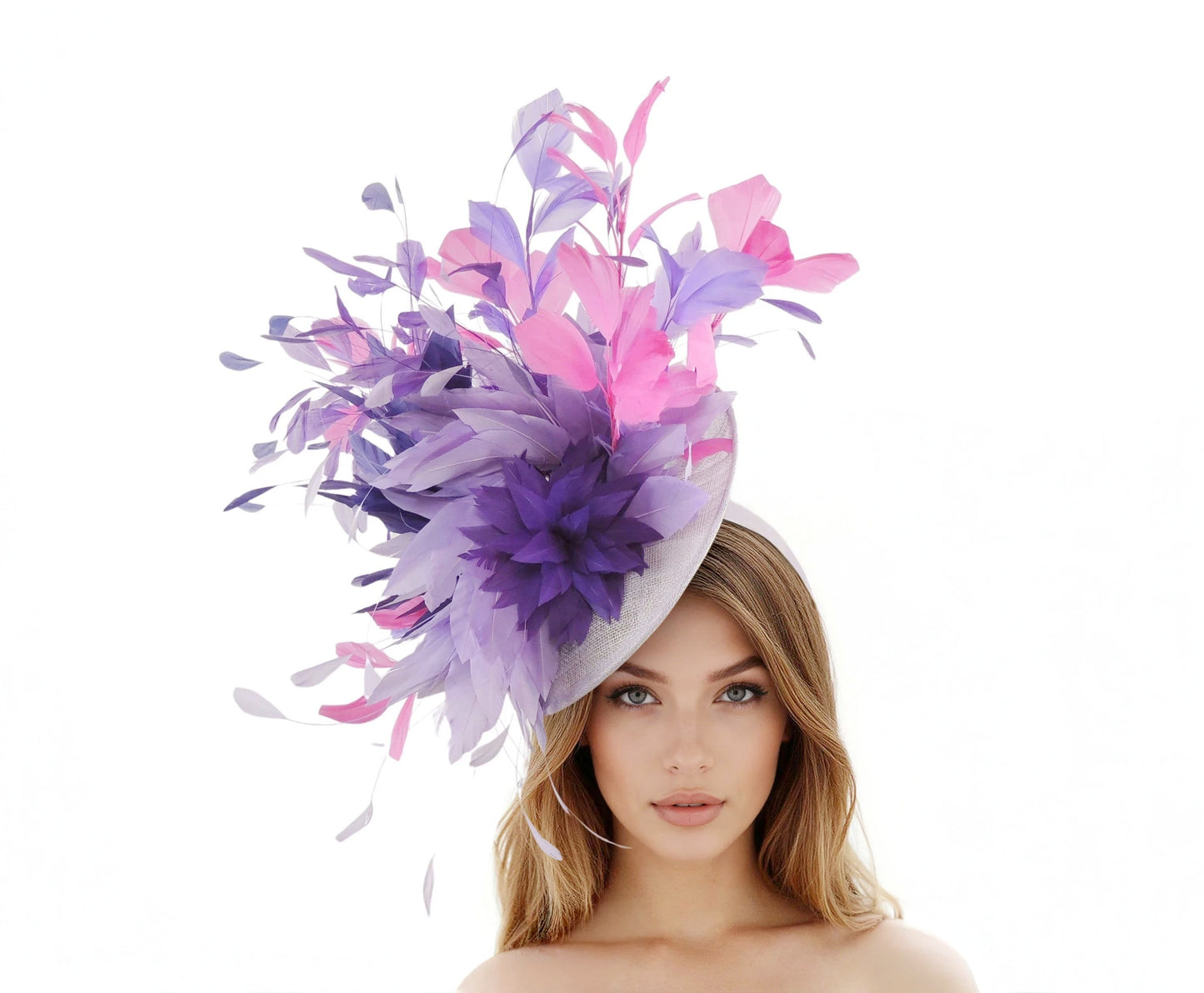Kami – Extra Large Feather Statement Derby & Ascot Fascinator in shades of purple and pink worn by a woman with loose hair