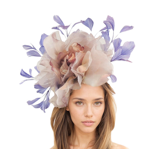 Woman wearing a decorative floral headpiece with purple and plum lilac flowers on a white background