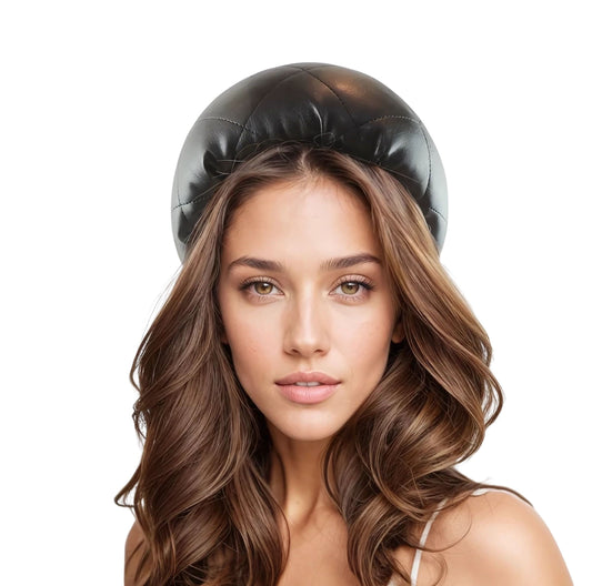 Woman with loose wavy hair wearing Megan - Black Extra Wide Quilted Vegan Faux Leather Headband Alice Band