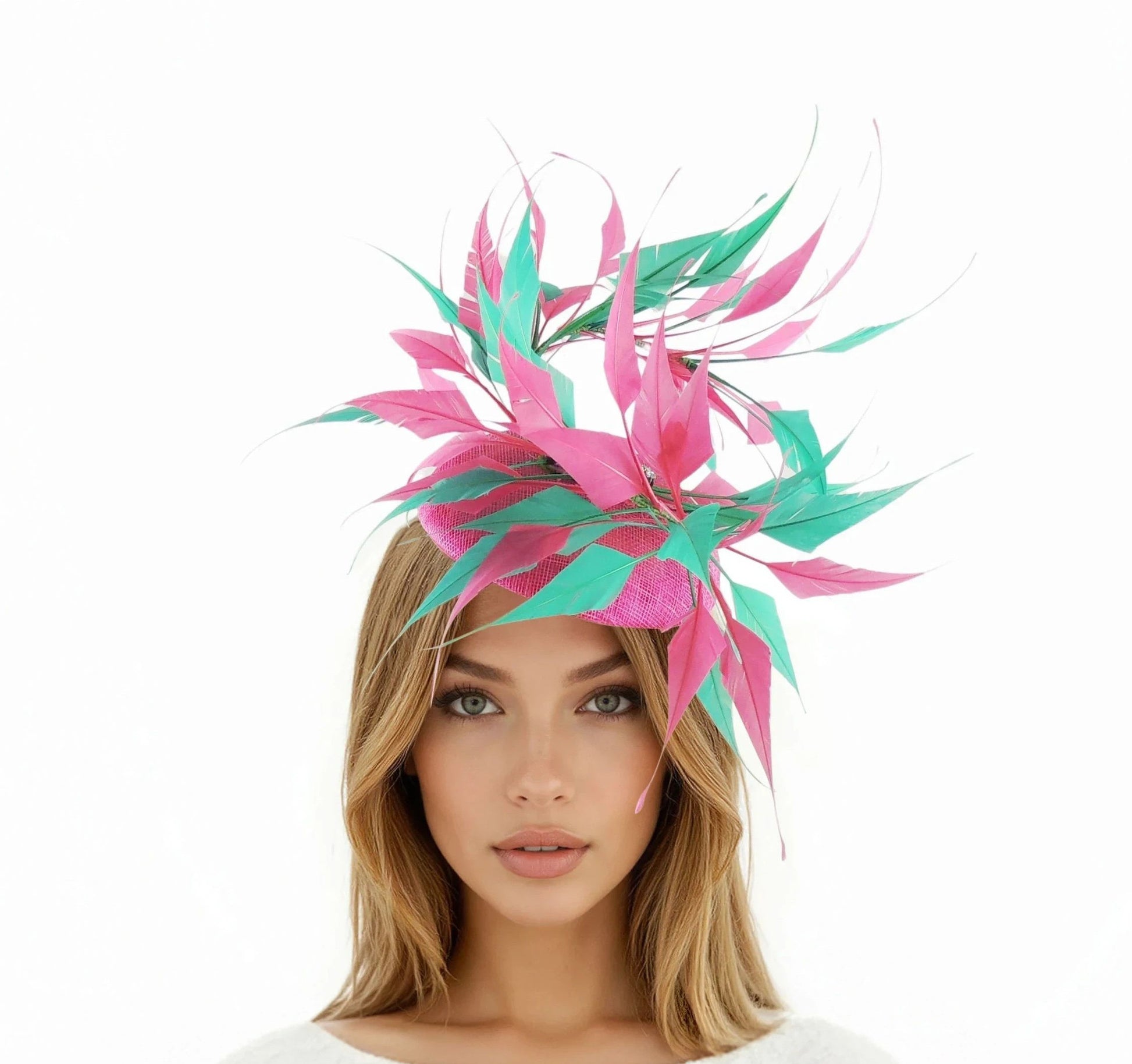 Piper Feather Percher Hat – Feather Statement Fascinator in pink and green worn by woman with loose hair and neutral makeup